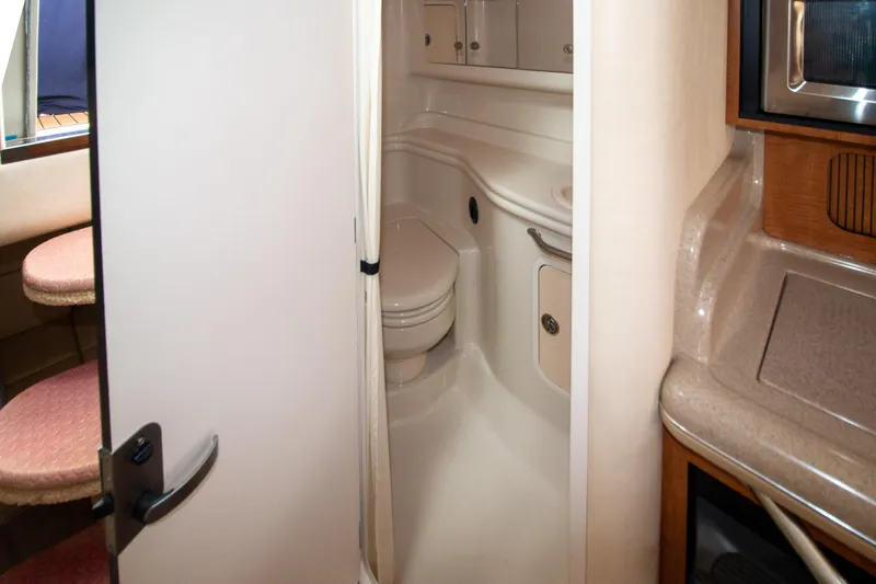 Slide: The Image of 2006 Sea Ray Sundancer 320 yacht bathroom interior with compact design and modern amenities. - 48