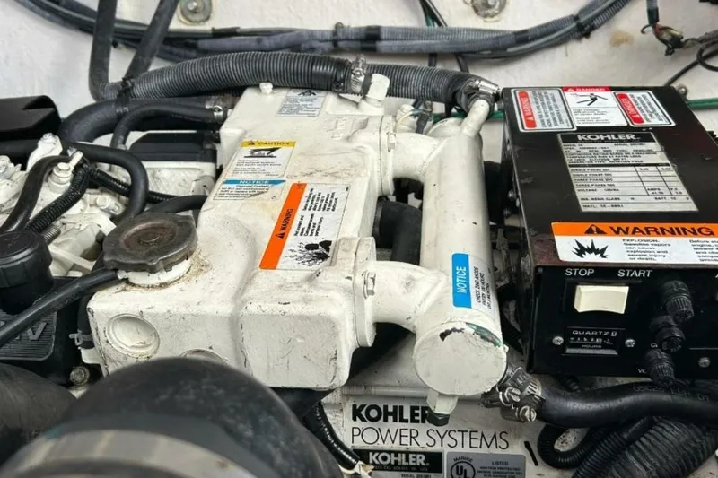 Slide: The Image of Engine compartment of a 2006 Sea Ray Sundancer 320 with Kohler power systems. - 54