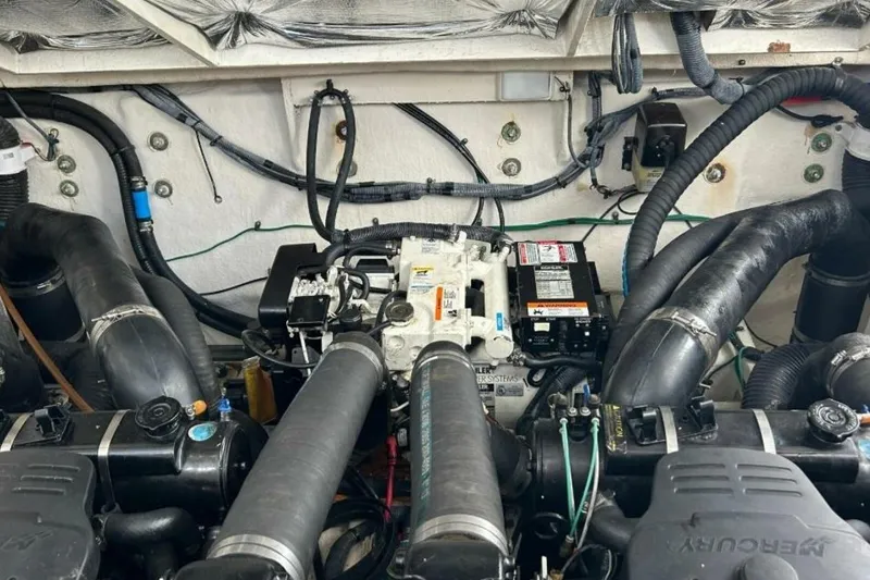 Slide: The Image of Engine compartment of a 2006 Sea Ray Sundancer 320 boat, showcasing mechanical components. - 57
