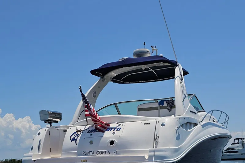 Slide: The Image of 2006 Sea Ray Sundancer 320 boat with American flag, docked in Punta Gorda, FL. - 6