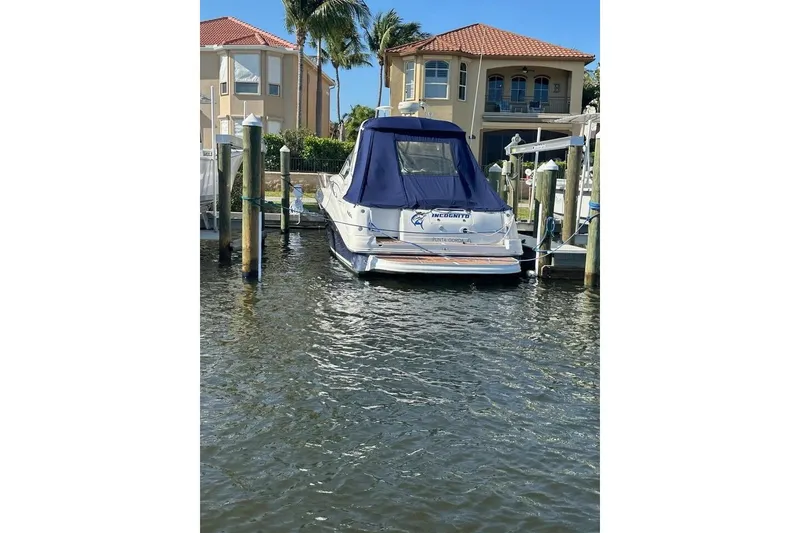 Slide: The Image of 2006 Sea Ray Sundancer 320 docked near waterfront homes. - 8