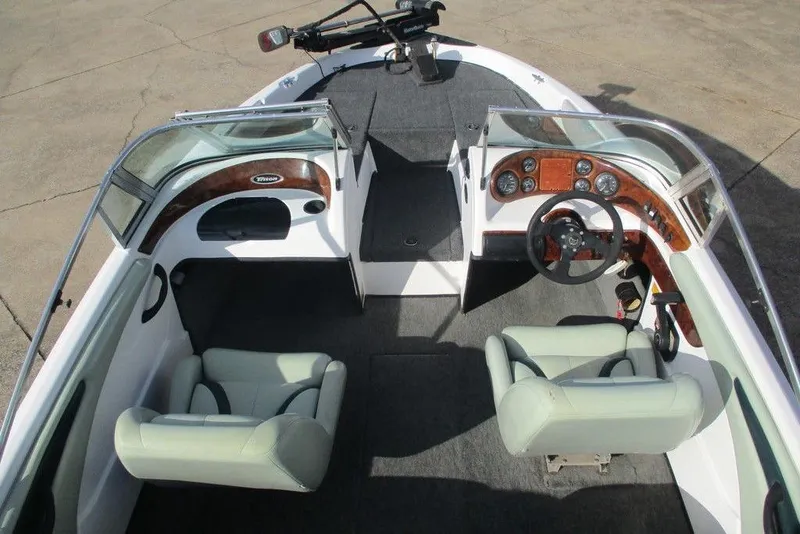 Slide: The Image of 2000 Triton SF-19 boat interior with dual seats and steering console. - 3