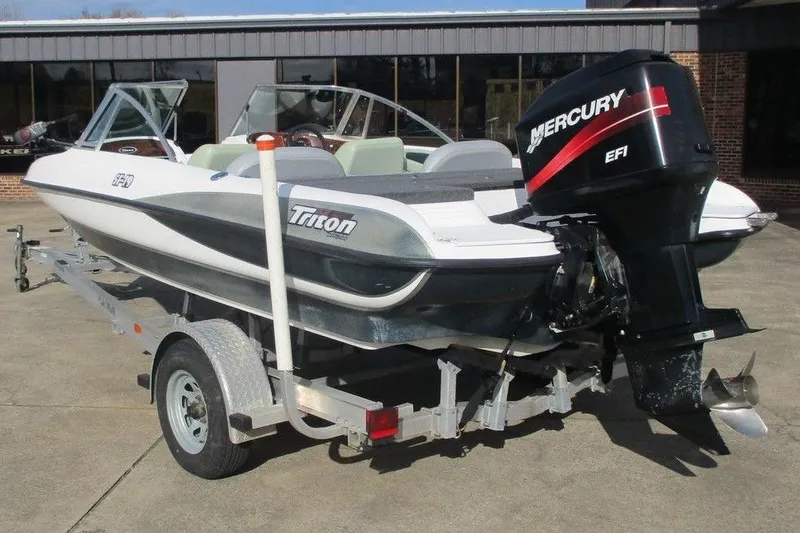 Slide: The Image of Triton SF-19 boat from 2000 with Mercury EFI engine on trailer. - 4