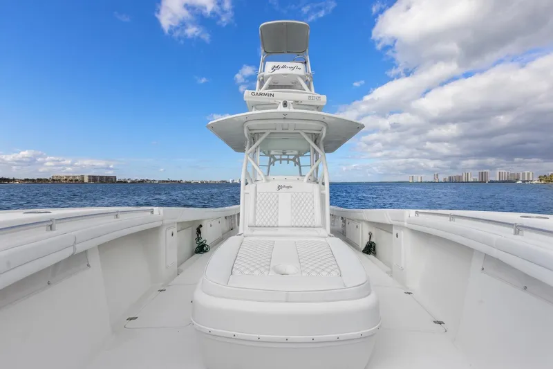 Slide: The Image of 2015 Yellowfin 39 Offshore boat on open water under blue sky. - 12