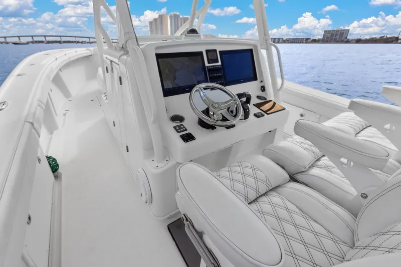 Slide: The Image of 2015 Yellowfin 39 Offshore boat interior with modern helm and luxurious seating. - 17