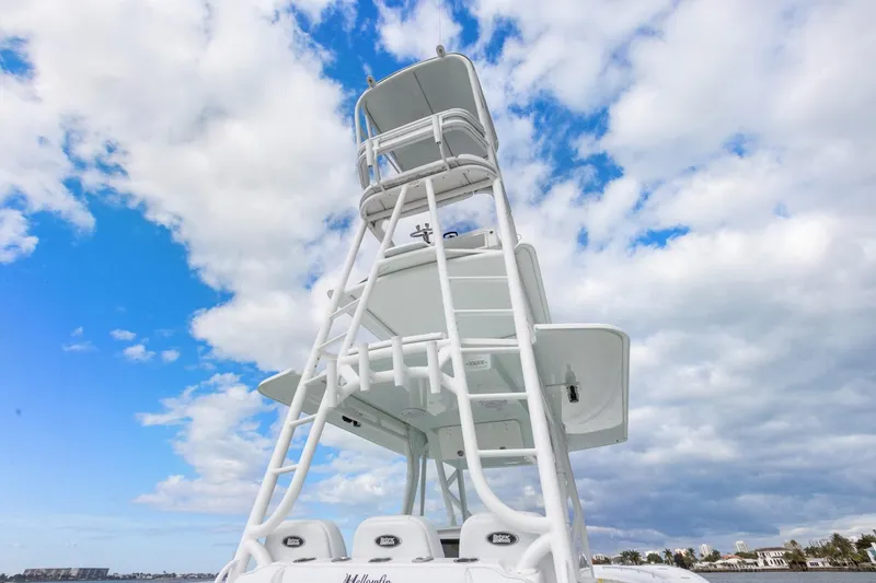 Slide: The Image of 2015 Yellowfin 39 Offshore boat tower against a cloudy blue sky. - 22