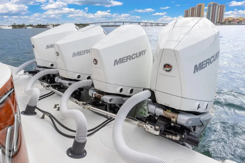 Slide: The Image of 2015 Yellowfin 39 Offshore boat with triple Mercury outboard engines on water. - 24