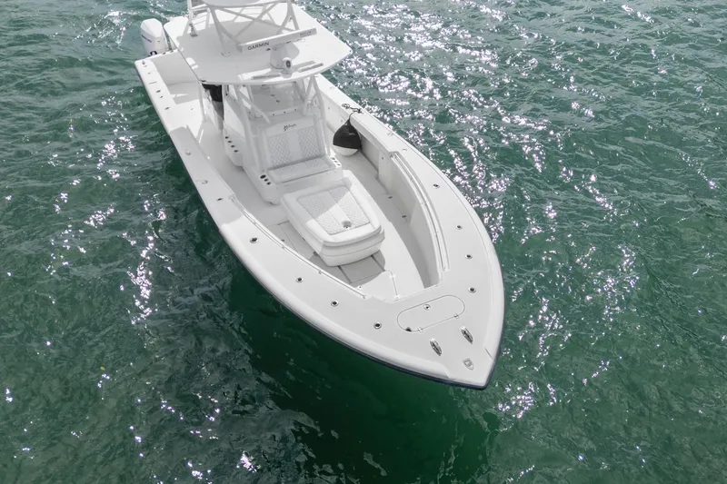 Slide: The Image of 2015 Yellowfin 39 Offshore boat on sparkling ocean water. - 7