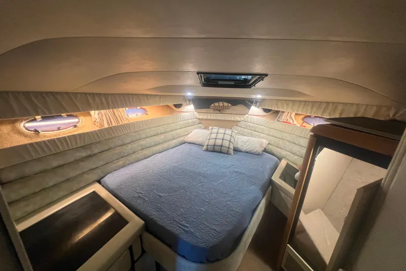 Slide: The Image of Interior of 1989 Bayliner 4285 Avanti yacht kitchen with countertop and hanging glasses. - 18