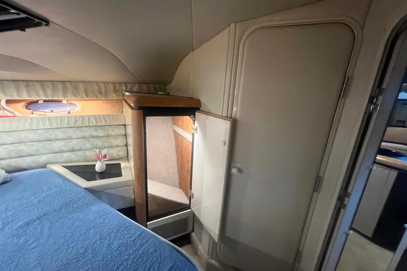 Slide: The Image of Interior of 1989 Bayliner 4285 Avanti yacht with curved seating and table. - 20