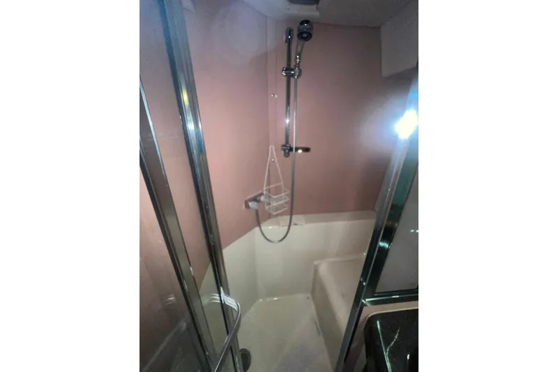 Slide: The Image of Shower area in 1989 Bayliner 4285 Avanti yacht with glass door and modern fixtures. - 36