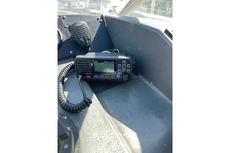 Slide: The Image of 1989 Bayliner 4285 Avanti helm with navigation equipment and steering wheel. - 5