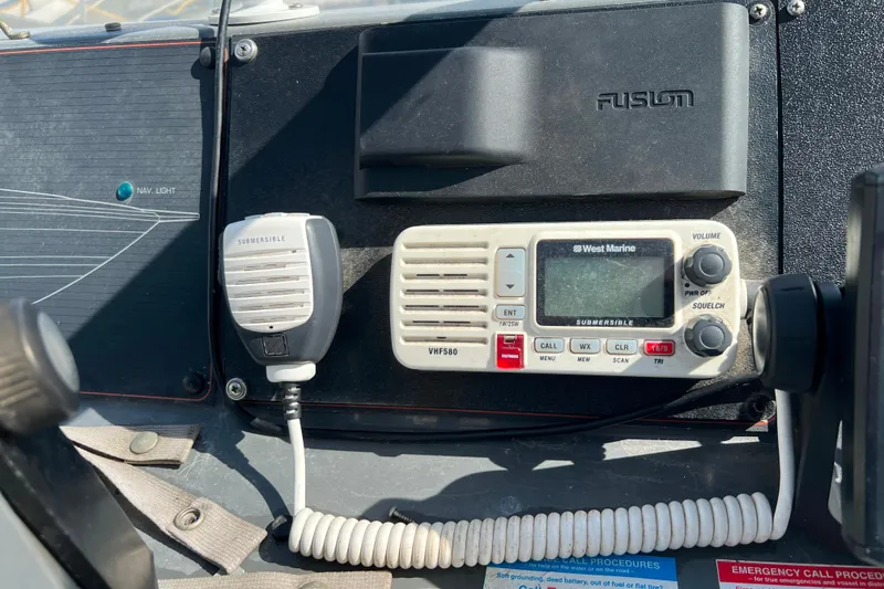 Slide: The Image of VHF marine radio and microphone on 1989 Bayliner 4285 Avanti boat dashboard. - 6