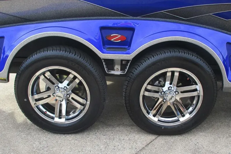 Slide: The Image of 2026 Ranger Z519 Cup-Equipped trailer with shiny chrome wheels and blue fender. - 10