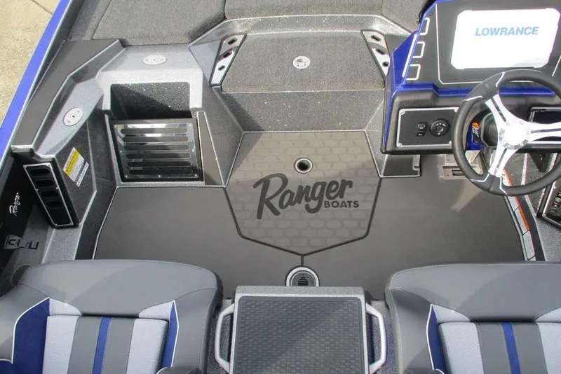 Slide: The Image of 2026 Ranger Z519 Cup-Equipped boat interior with steering wheel and Lowrance display. - 11