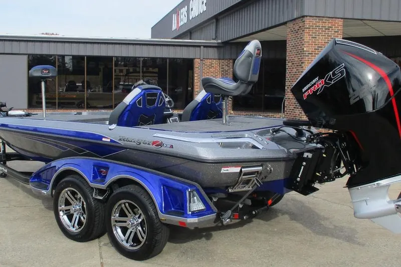 Slide: The Image of 2026 Ranger Z519 Cup-Equipped boat with Mercury Pro XS engine, parked outside dealership. - 4