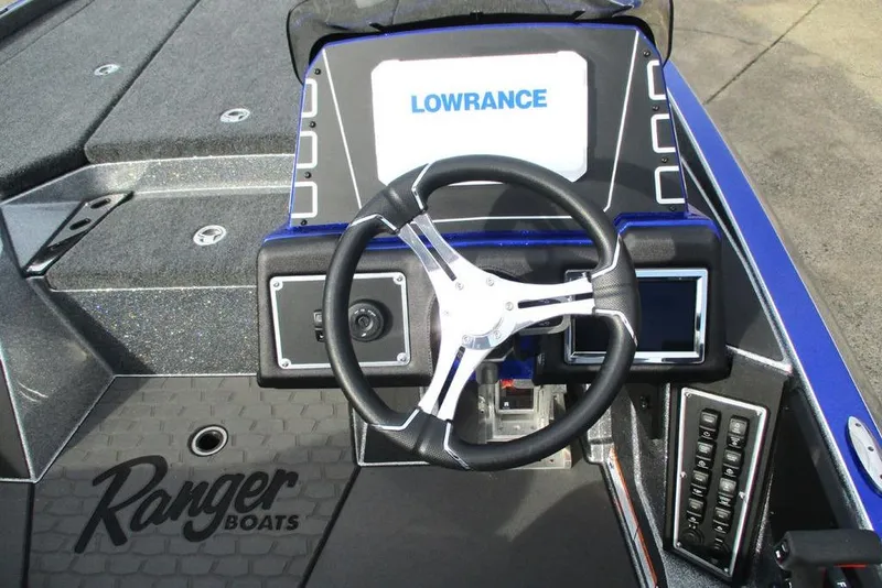 Slide: The Image of 2026 Ranger Z519 Cup-Equipped boat dashboard with steering wheel and Lowrance display. - 6