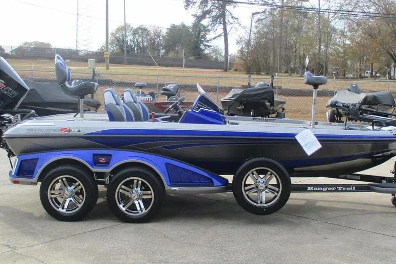 Slide: The Image of 2026 Ranger Z519 Cup-Equipped boat with blue accents on a trailer. - 7