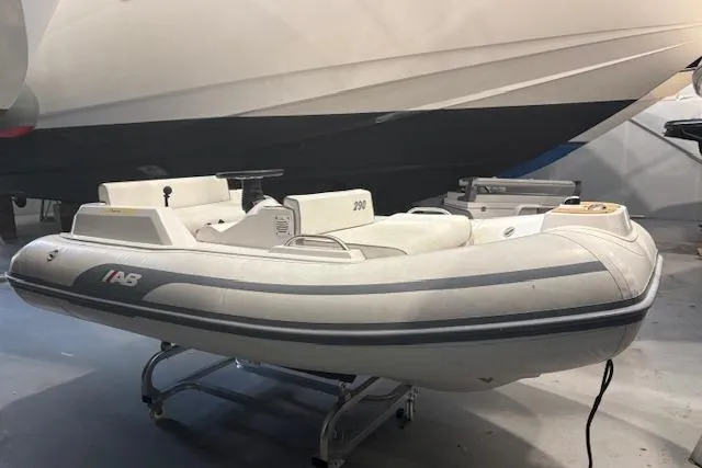 Slide: The Image of 2023 AB Inflatables ABJET 290 inflatable boat in a showroom setting. - 11