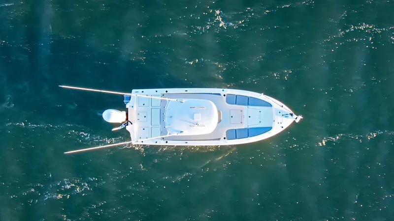 Slide: The Image of Aerial view of a 2024 Pathfinder 2600 TRS boat on water. - 13