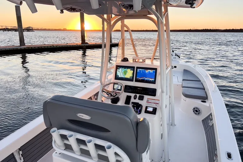 Slide: The Image of 2024 Pathfinder 2600 TRS boat at sunset on water. - 17