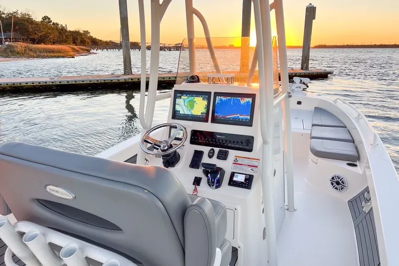 Slide: The Image of 2024 Pathfinder 2600 TRS boat at sunset dock. - 21