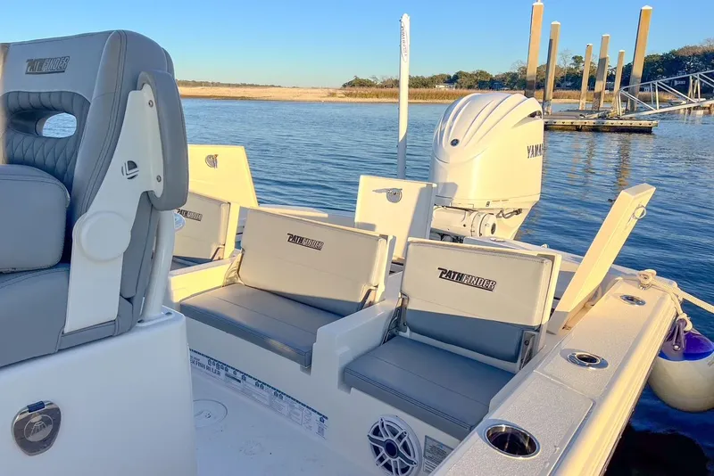 Slide: The Image of 2024 Pathfinder 2600 TRS boat with Yamaha engine on calm water. - 31