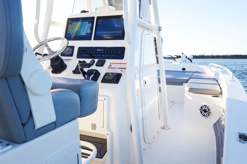 Slide: The Image of Interior view of 2024 Pathfinder 2600 TRS boat with modern helm console. - 36