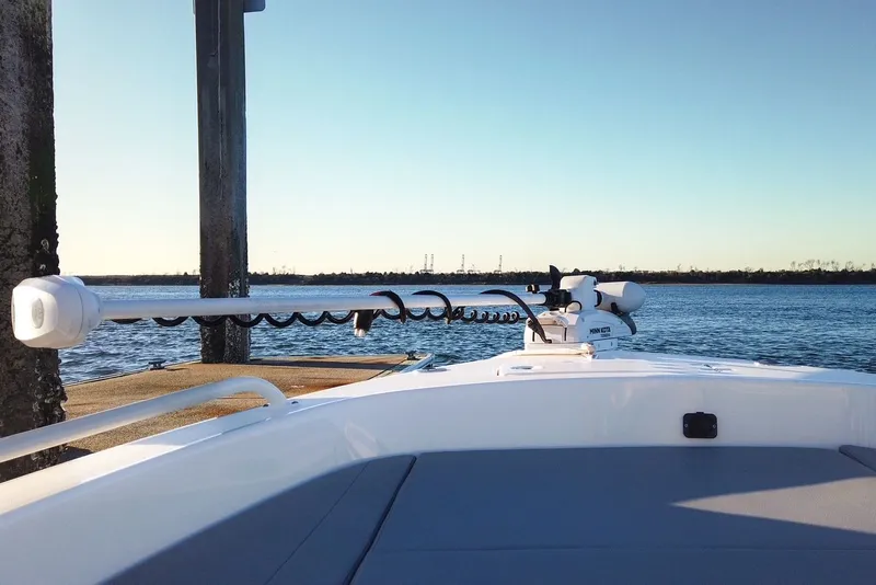 Slide: The Image of Pathfinder 2600 TRS 2024 boat on calm water at sunset. - 43