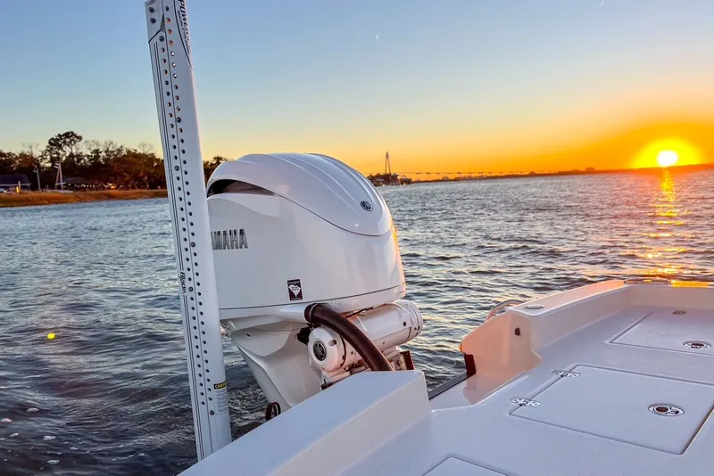 Slide: The Image of Pathfinder 2600 TRS boat at sunset on the water, 2024 model. - 47