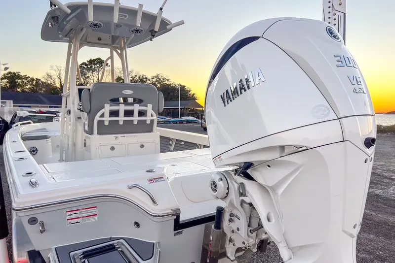 Slide: The Image of 2024 Pathfinder 2600 TRS boat with Yamaha engine at sunset. - 48