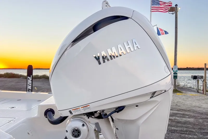 Slide: The Image of Yamaha motor on Pathfinder 2600 TRS boat at sunset. - 49