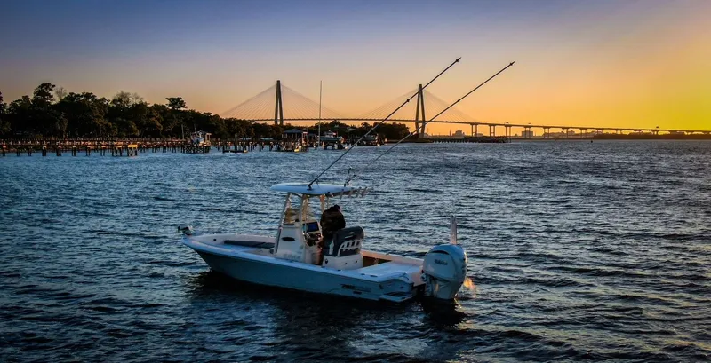 Slide: The Image of Pathfinder 2600 TRS 2024 boat on water at sunset. - 5