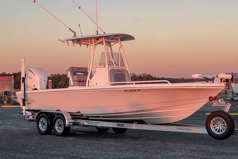 Slide: The Image of 2024 Pathfinder 2600 TRS boat on trailer at sunset. - 8