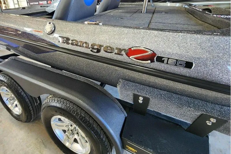Slide: The Image of 2026 Ranger Z185 boat with metallic finish on a dual-axle trailer. - 11