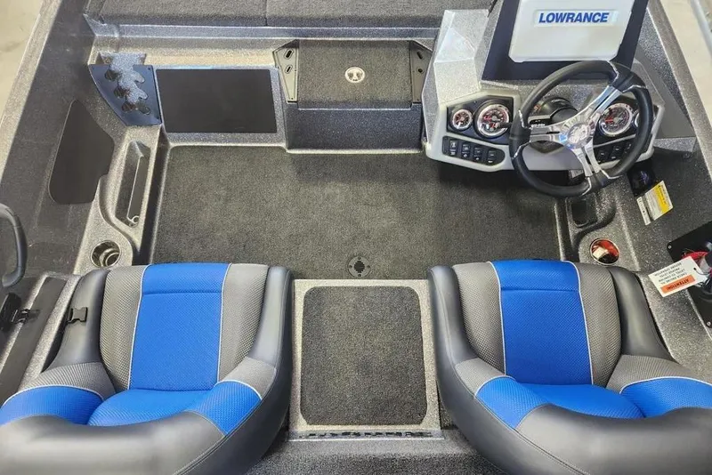 Slide: The Image of 2026 Ranger Z185 boat interior with blue seats and Lowrance dashboard. - 6