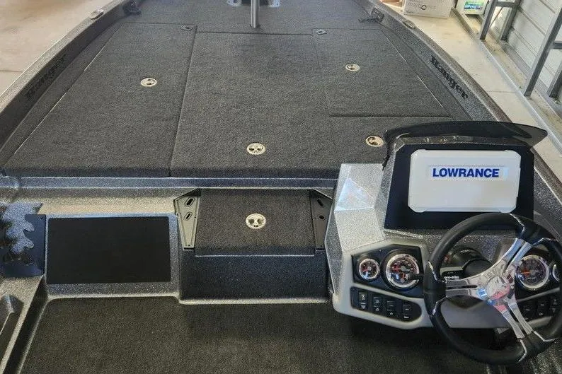 Slide: The Image of 2026 Ranger Z185 boat interior with Lowrance navigation system and steering console. - 7