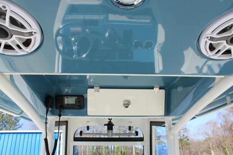 Slide: The Image of 2026 Cobia 285 Center Console boat interior with speakers and control panel. - 17