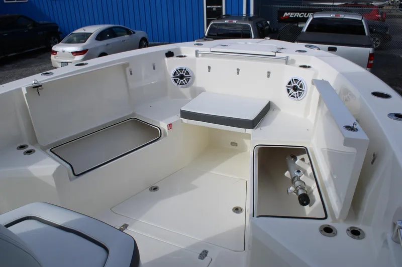 Slide: The Image of 2026 Cobia 285 Center Console boat interior with storage compartments and seating. - 21