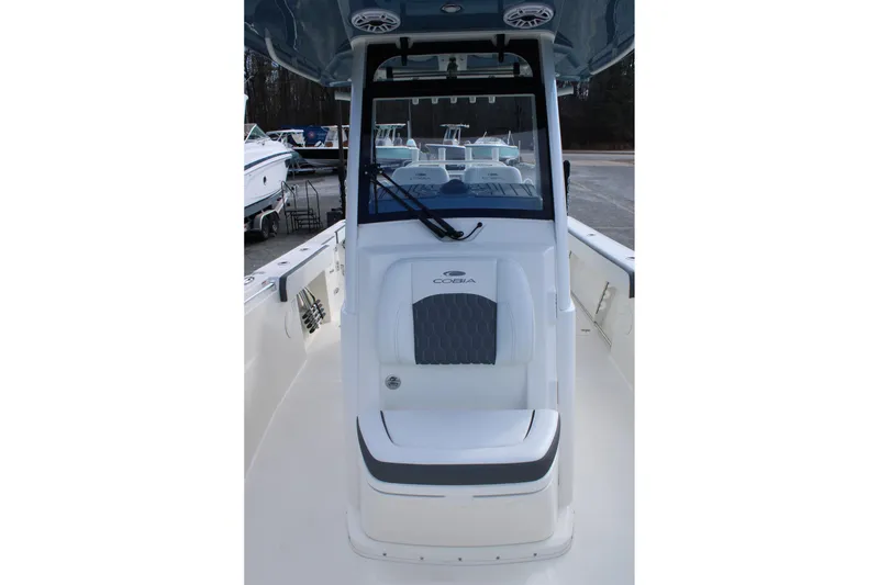 Slide: The Image of 2026 Cobia 285 Center Console boat interior with seating and console view. - 22