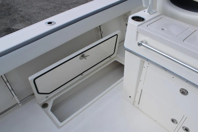 Slide: The Image of 2026 Cobia 285 Center Console boat interior storage and utility area. - 26