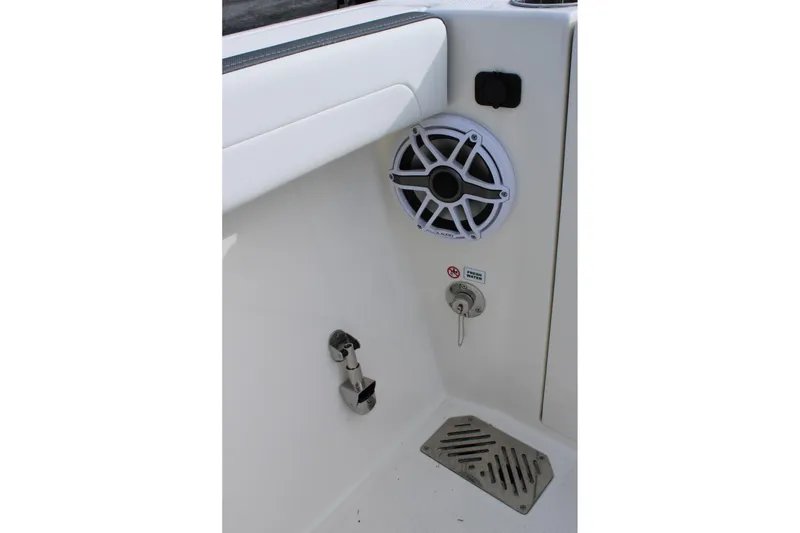 Slide: The Image of 2026 Cobia 285 Center Console boat interior with speaker and drainage system. - 28
