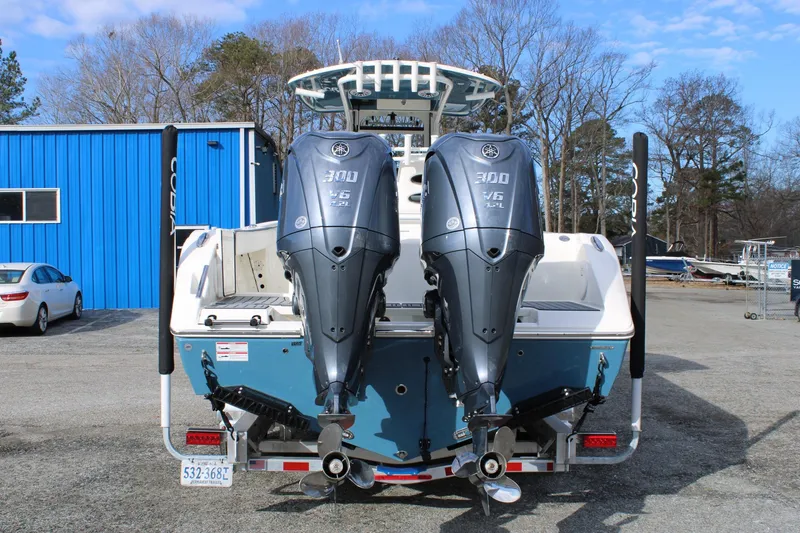 Slide: The Image of 2026 Cobia 285 Center Console boat with dual Yamaha 300 V6 engines. - 3