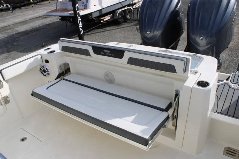 Slide: The Image of 2026 Cobia 285 Center Console boat with foldable seating and twin engines. - 30
