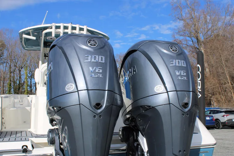 Slide: The Image of 2026 Cobia 285 Center Console with dual Yamaha 300 V6 outboard engines. - 9