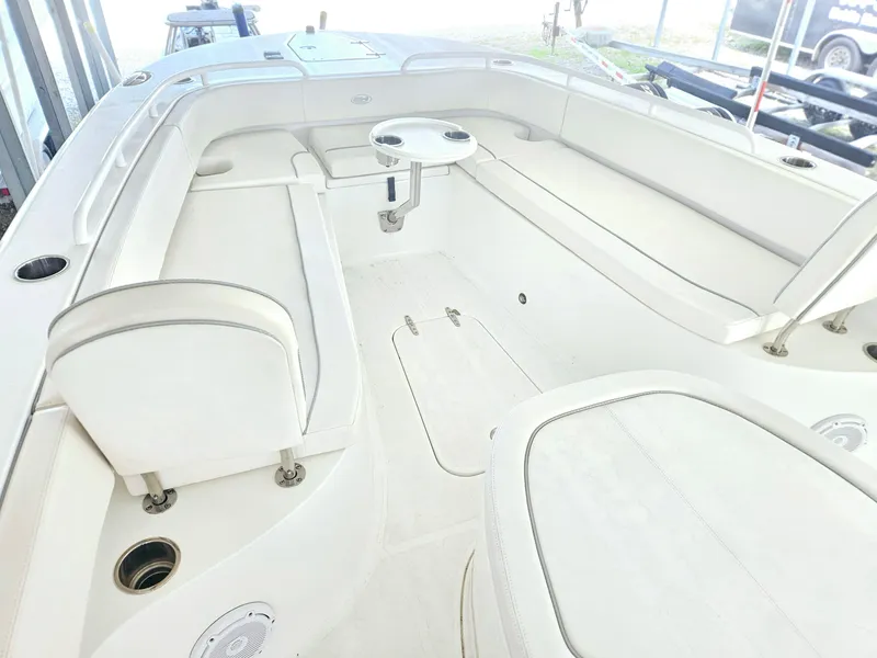 Slide: The Image of 2023 Sea Hunt Escape 28 boat interior with sink and cup holders. - 13