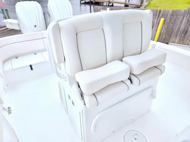 Slide: The Image of 2023 Sea Hunt Escape 28 boat interior with open storage compartment and sink. - 15