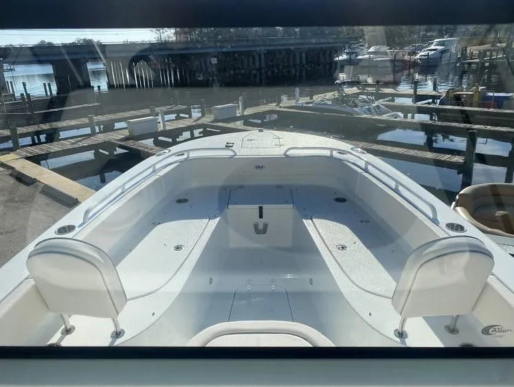 Slide: The Image of 2023 Sea Hunt Escape 28 helm with Garmin displays and steering wheel. - 21