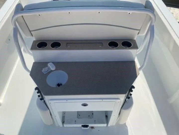 Slide: The Image of 2023 Sea Hunt Escape 28 helm with dual screens and modern controls. - 22