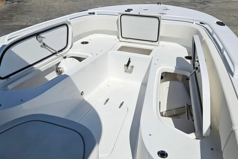 Slide: The Image of 2023 Sea Hunt Escape 28 boat interior with open storage compartments. - 29